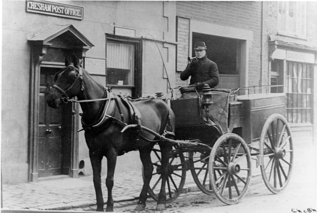 A man on a horse and cart outside Chesham post office