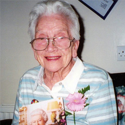 Hilda Flello holding a picture of the Queen