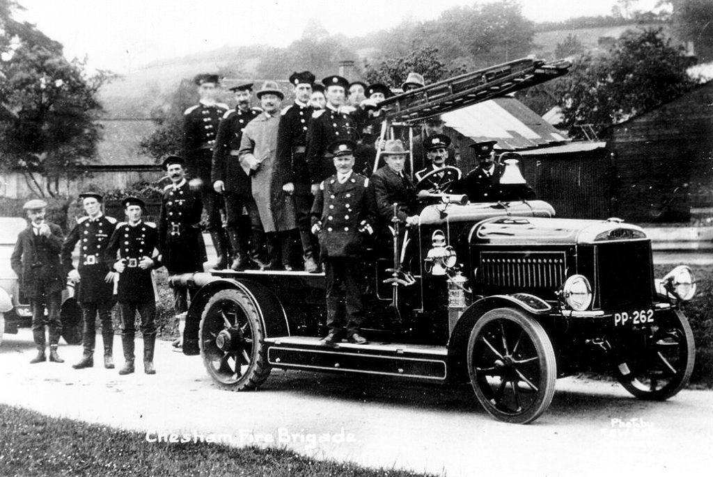 FE2 fire engine with men standing on it and behind it