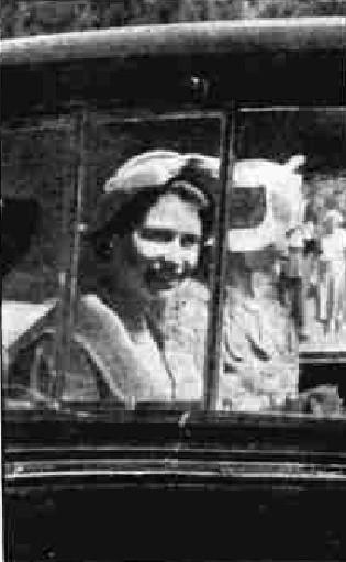 Queen Elizabeth inside her car