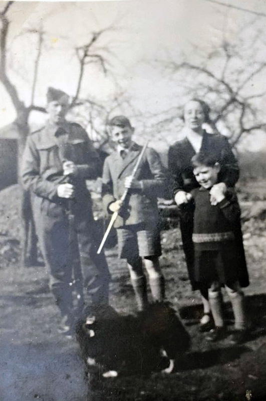 Photo of uncle Fred in his uniform with his family