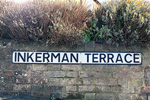 Inkerman Terrace road sign on a wall