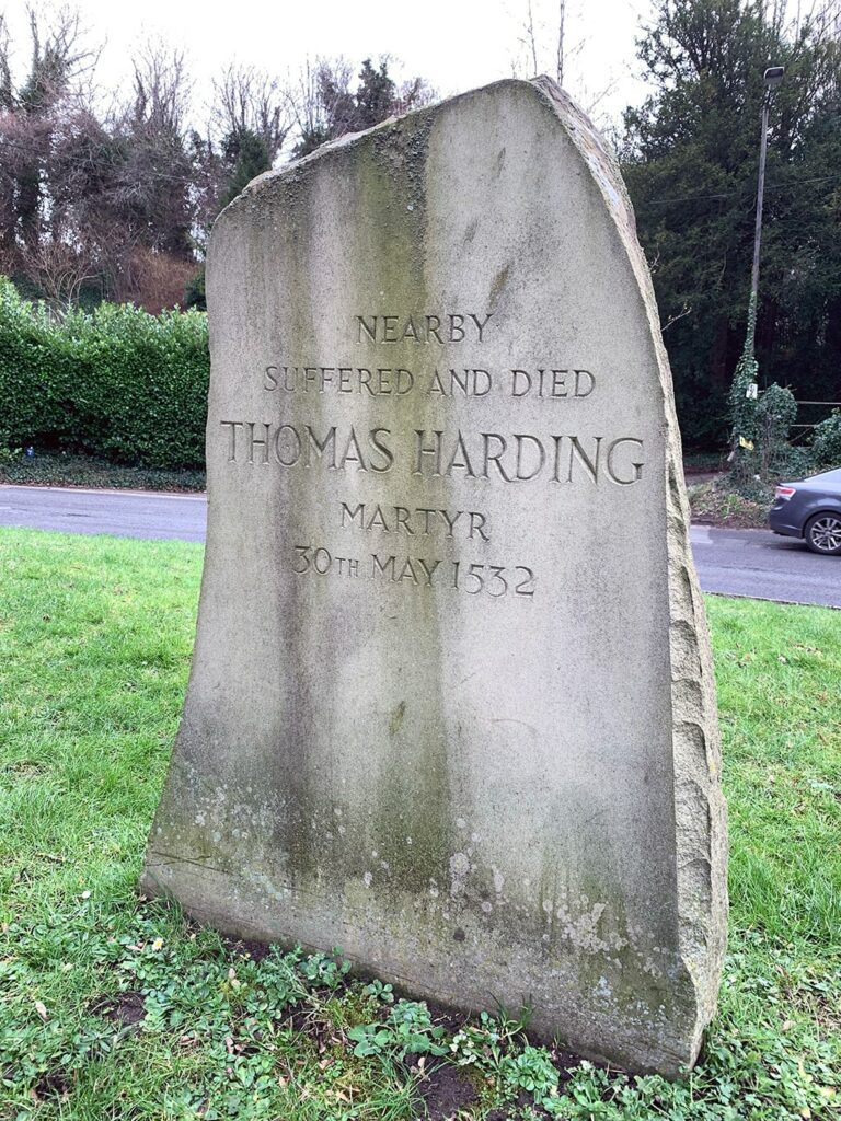 Gravestone that states nearby suffered and died Thomas Harding Martyr 30 May 1532