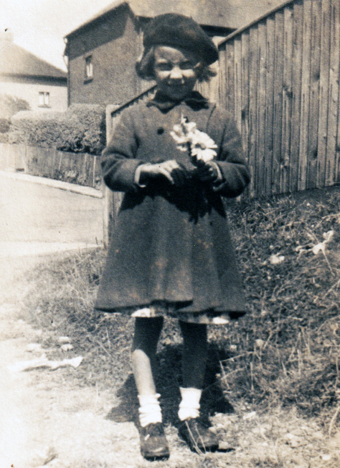 Black and white photo of Sylvia, a young girl and the original owner of the doll's house.