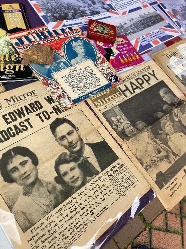 Newspaper covers and other media celebrating previous Royal events. Some of the front pages mention Edward; there is a Jubilee magazine and the Daily Mirror with a photo of Queen Elizabeth and family with the headline Happy
