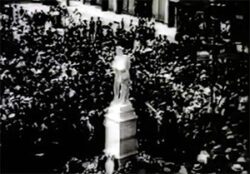 A photo of the Chesham War Memorial surrounded by crowds of people. The image is black and white.