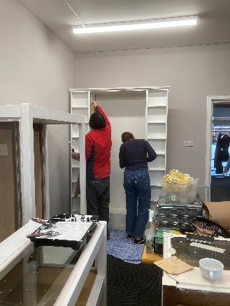 Volunteers paint the new exhibition space