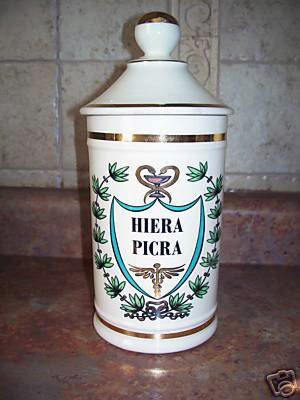 Jar of Hiera Picra - the jar is white with a lid and has the words Hiera Picra inside an emblem.